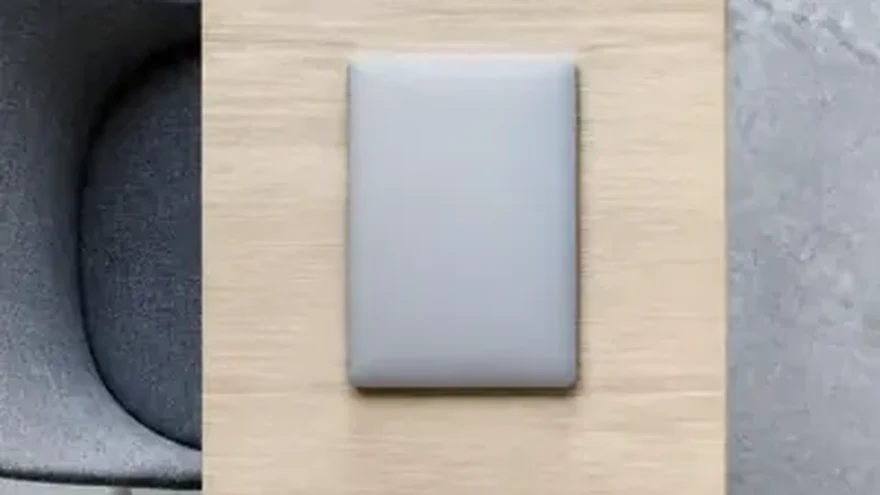 Two identical desks facing each other with one object on each