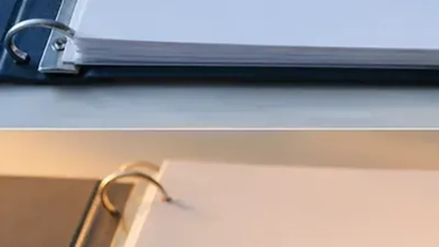An organised overview of printed documents fanned out on a desk